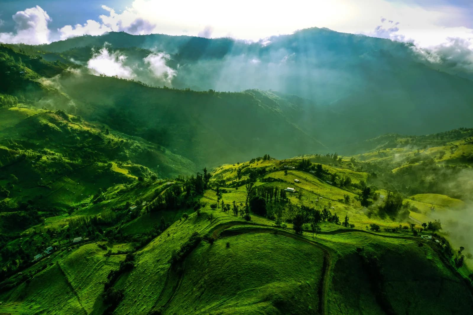 Lush green valley and mountain slopes in the Ecuadorian Andes