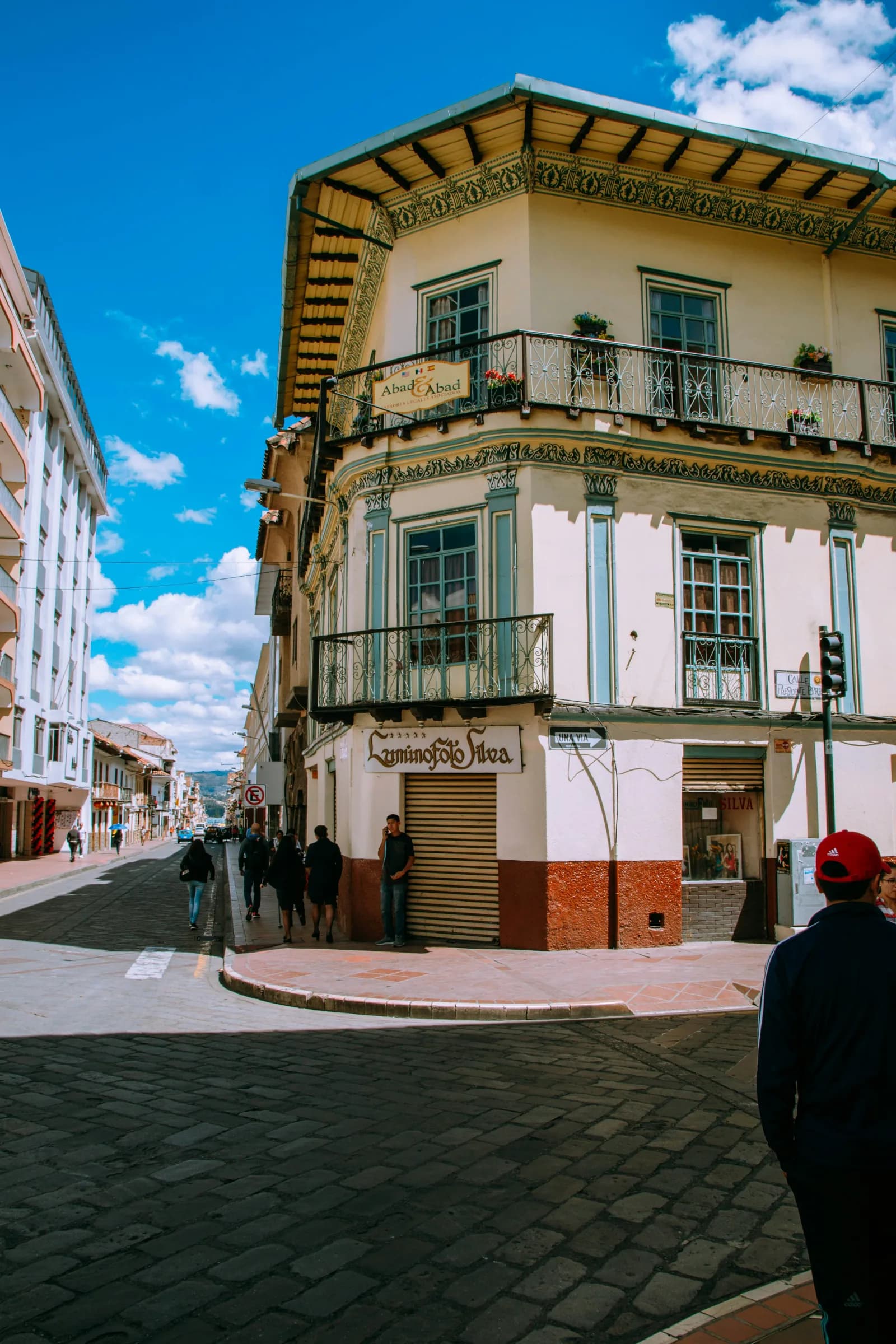 Colorful historic building on a Cuenca street